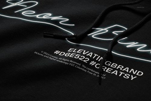 Detailed PSD mockup of a black hoodie featuring white text and neon-style lettering, viewed from an angled perspective.