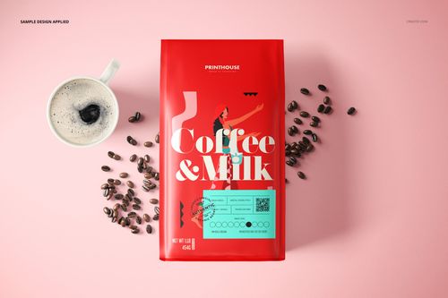 Top view of a red side gusset bag mockup surrounded by coffee beans and a cup of coffee on a pastel pink background.