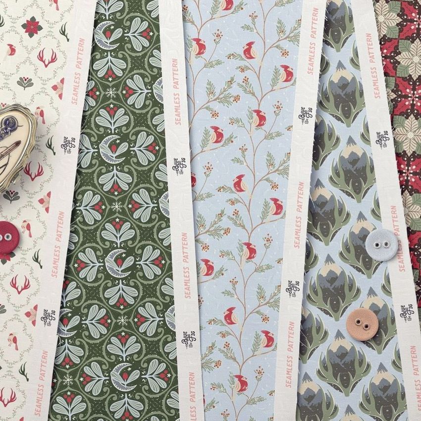 Cotton fabric sample mockup showing several strips of patterned fabric with floral and bird designs, buttons, and a pin cushion.