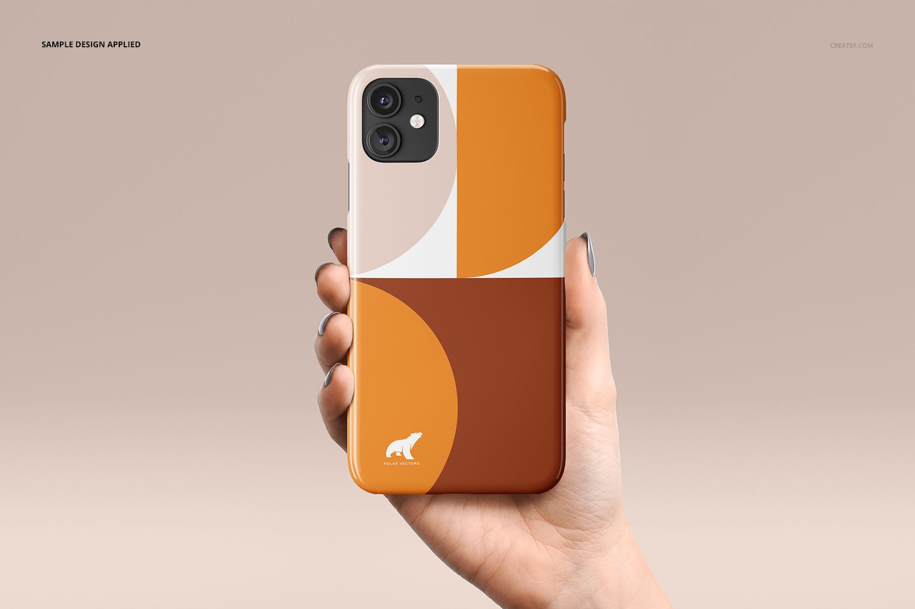 Glossy iPhone 11 snap case mockup with a bold geometric pattern in orange, brown, and white, shown in a hand.