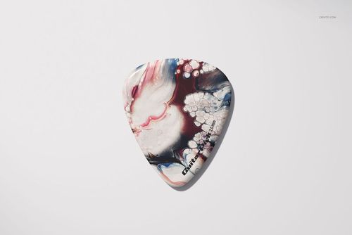Single guitar pick mockup featuring a fluid, colorful design in shades of pink, blue, and black on a white background.