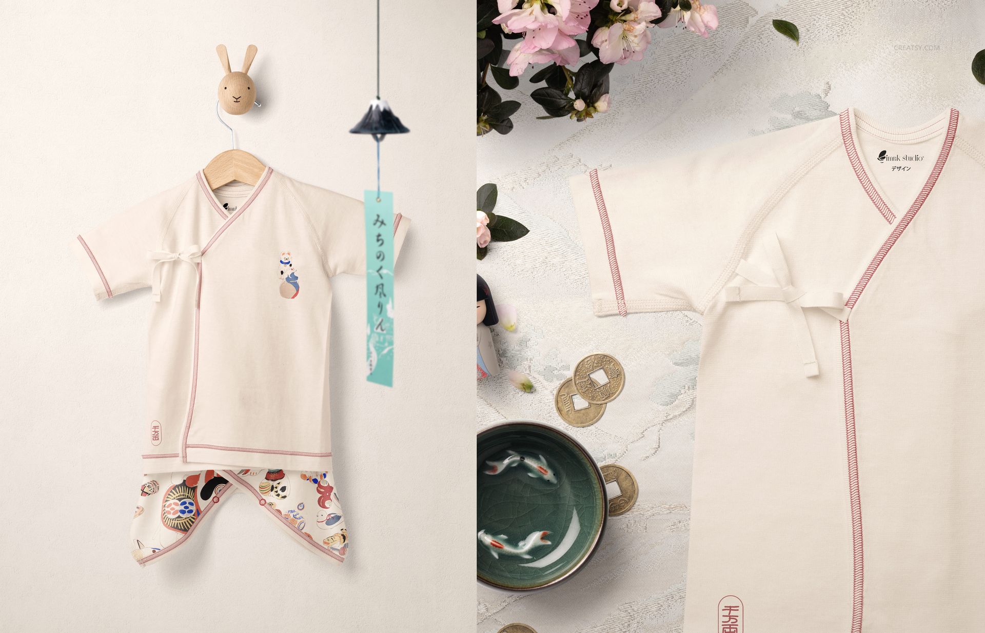 Front view of an organic cotton baby kimono bodysuit mockup in off-white with pink trim, displayed on a hanger.