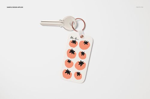 Rectangular key tag mockup with rounded corners, featuring a tomato pattern and attached to a silver key on a white background.