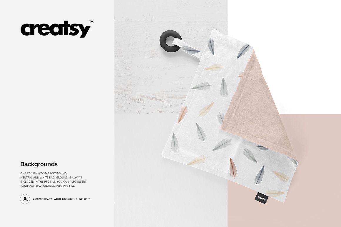 Mockup of a soft teething blanket featuring a feather print, silicone ring, and removable label on a light surface.