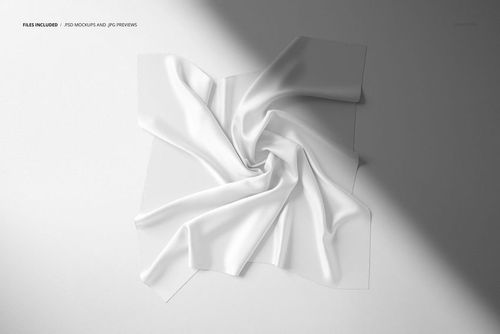 White silk scarf mockup with visible folds and creases, presented from above on a neutral background.