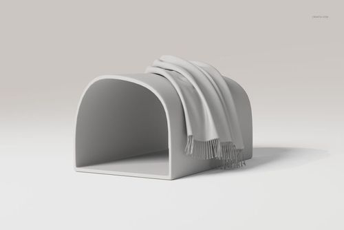 Draped throw blanket in light gray color displayed on a curved, minimalist stand against a neutral background.