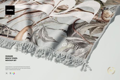 Botanical-themed fringed beach towel mockup displayed in a partial top-down perspective with detailed tassel edges.