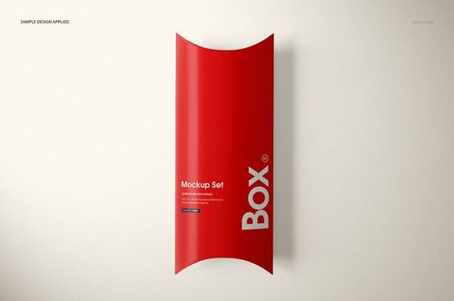 Front view of a red pillow box with white text, displayed on a plain light background, packaging mockup.