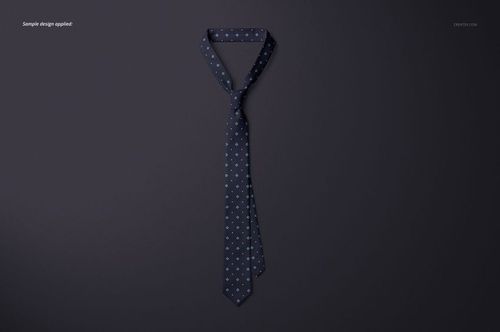 Necktie mockup featuring a navy tie with repeating light blue motif, arranged neatly on a plain surface.