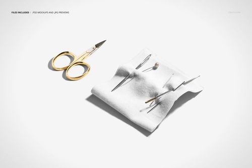 Cotton fabric mockup featuring sewing needles inserted into the material and gold scissors placed nearby on a clean surface.