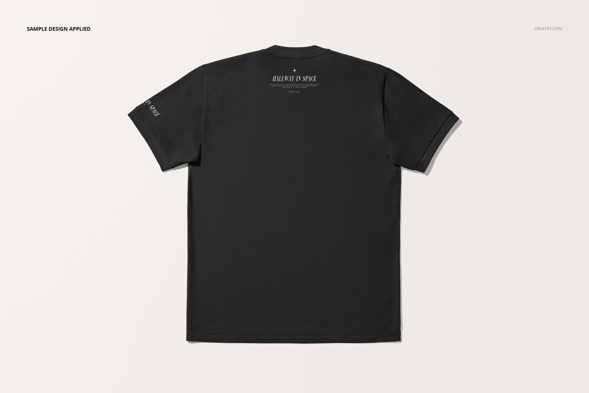 Oversized black t-shirt mockup shown from the back on a plain white background, displaying printed text near the collar.