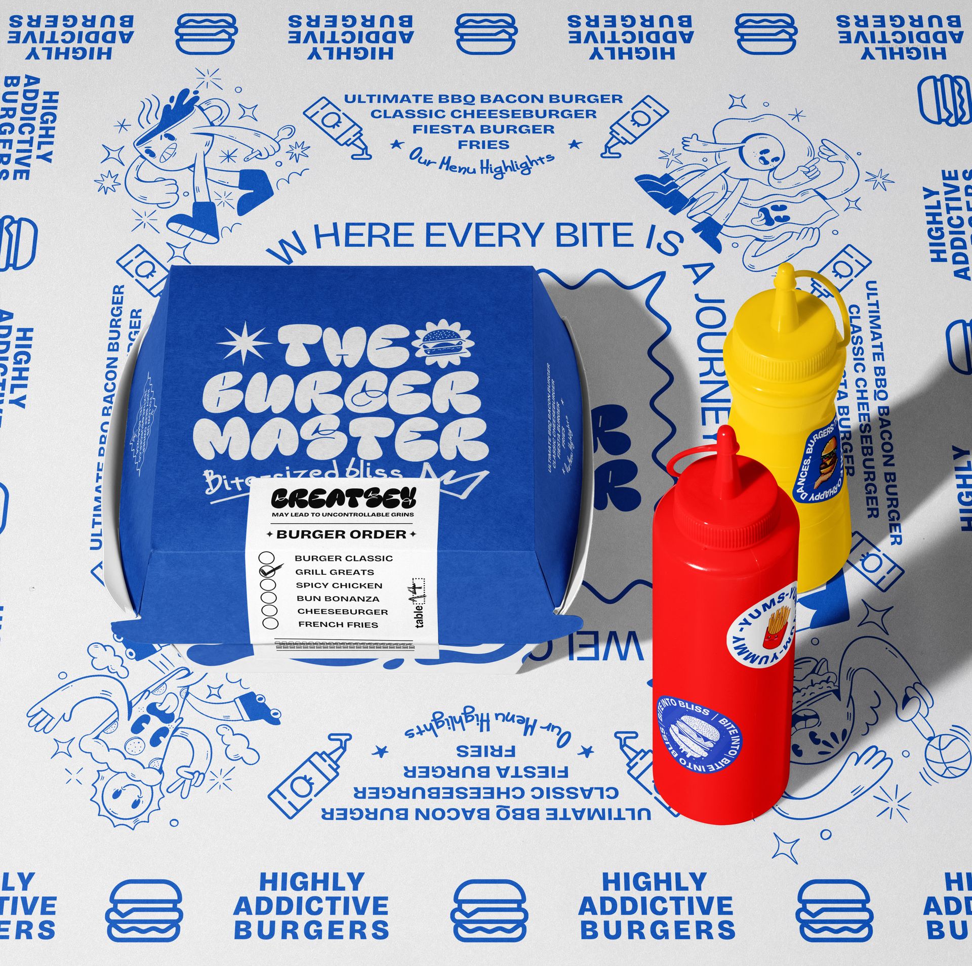 Blue burger packaging mockup displayed on graphic paper, accompanied by red ketchup and yellow mustard bottles.