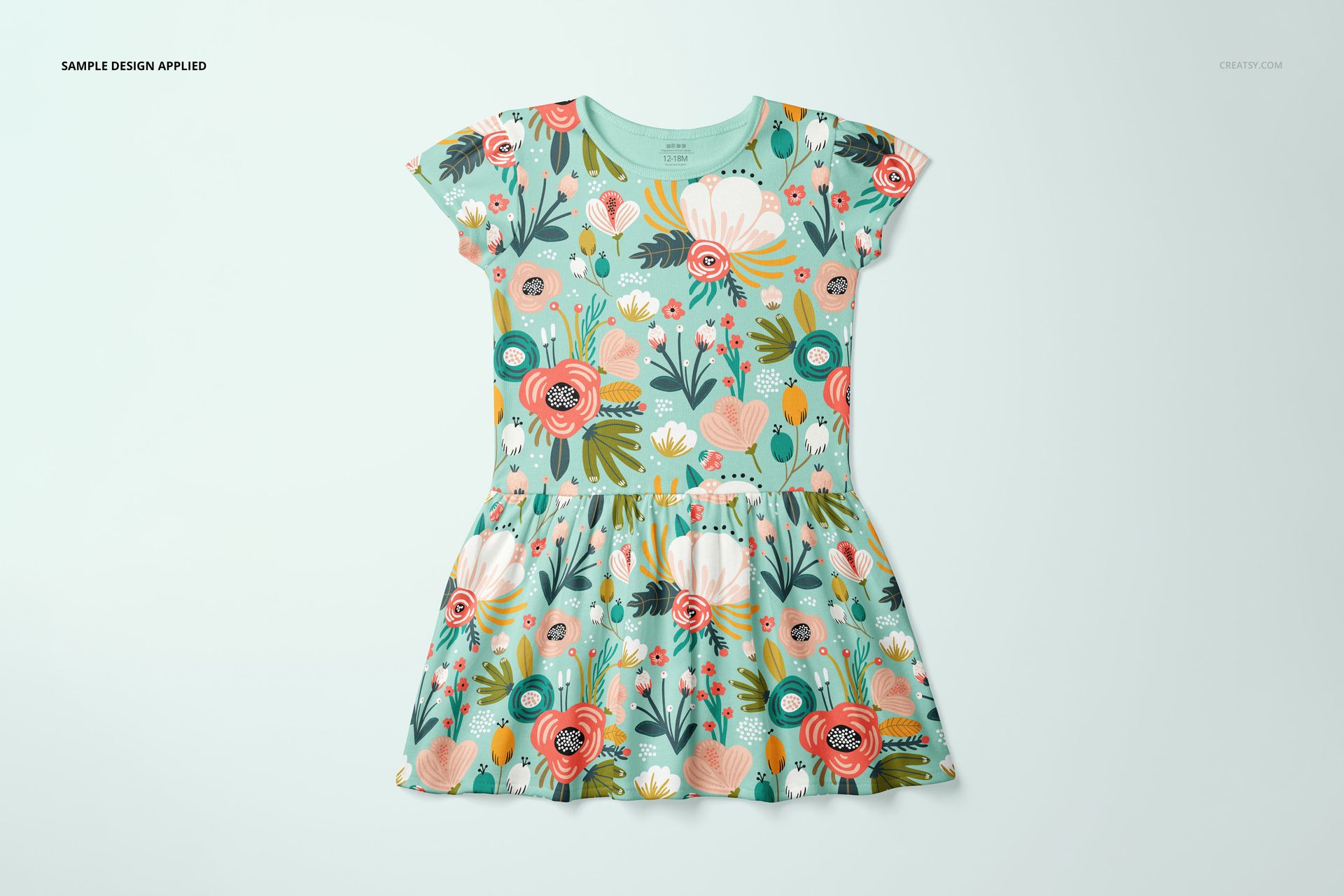 Front view of a toddler rib dress mockup featuring a colorful floral pattern on a light green background.