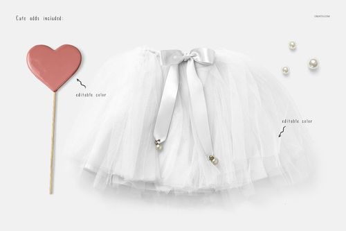 Front view of a girls white tulle skirt mockup with satin ribbon bow, surrounded by pearls and a heart-shaped prop.
