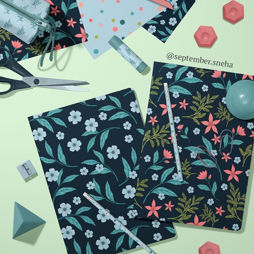 Stationery mockup featuring two classic A4 notebooks with floral covers, surrounded by scissors, tape, and geometric props on a pastel surface.