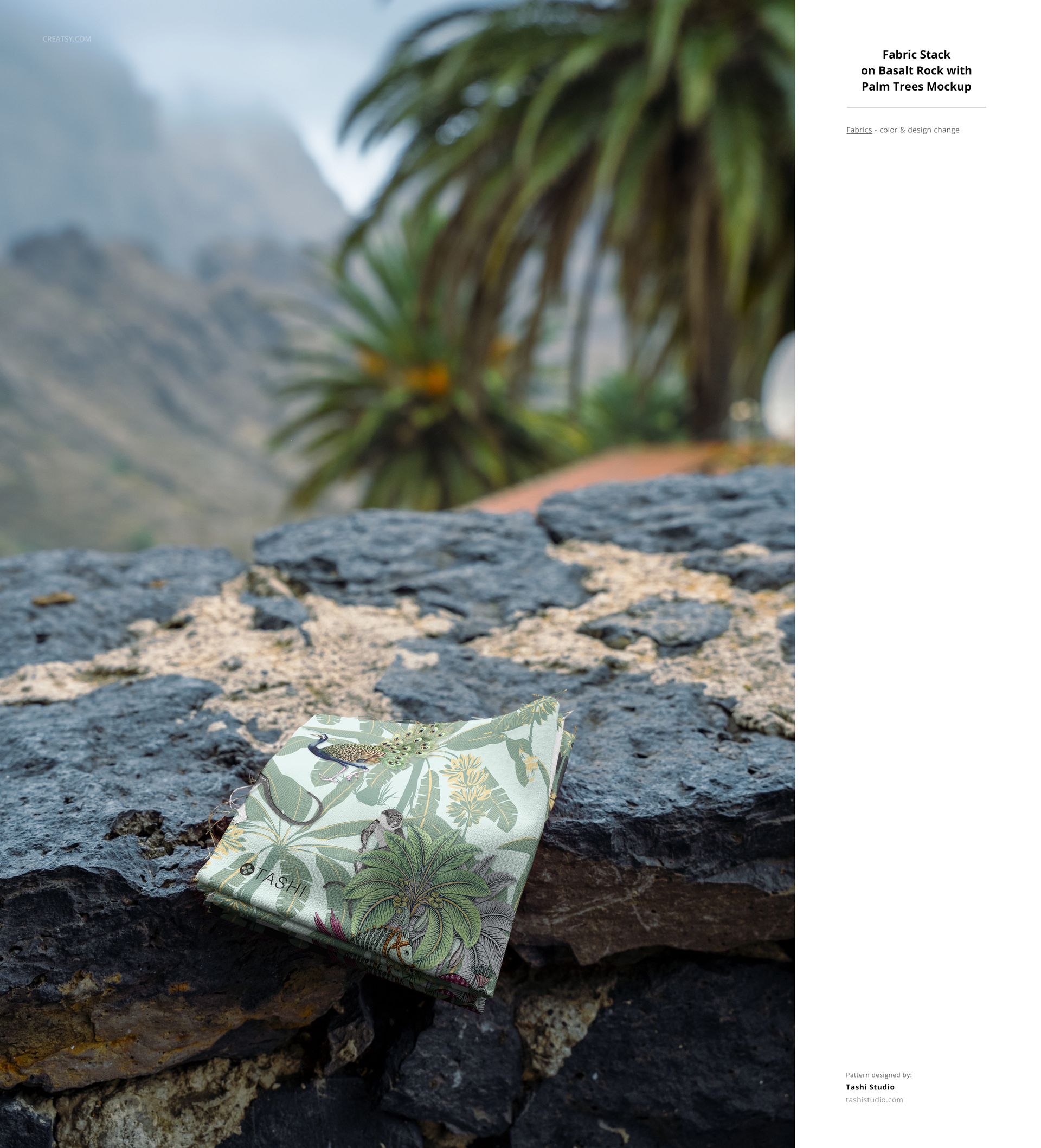 Fabric mockup displaying botanical patterns, set on a rocky ledge with palm trees and misty mountains behind.