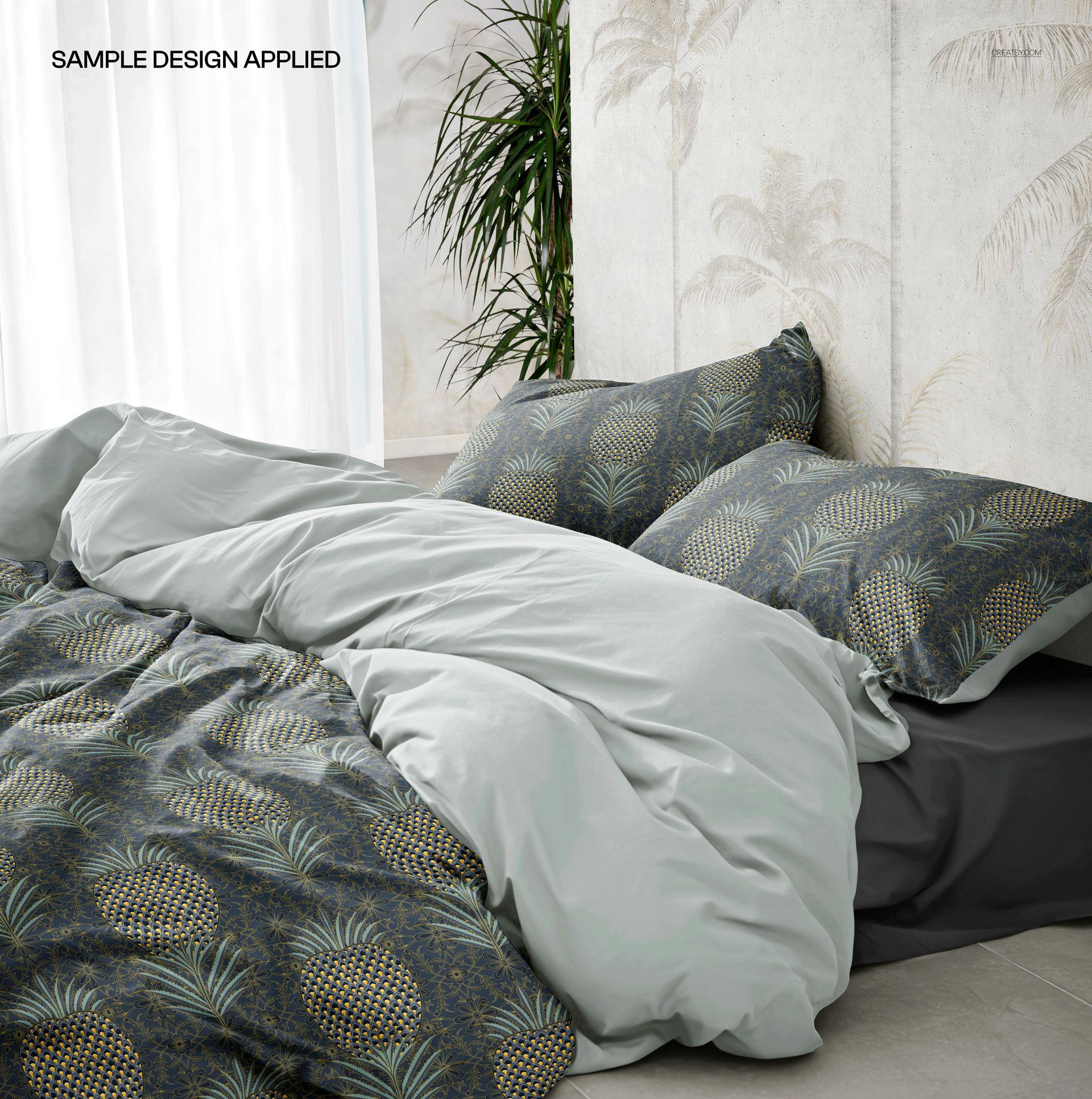 PSD mockup of a rumpled duvet cover and pillows featuring a leafy design, shown in a contemporary room with plants.
