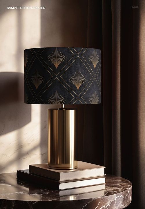 PSD mockup of a brass table lamp with geometric design drum shade, sunlight casting shadows in a modern interior.