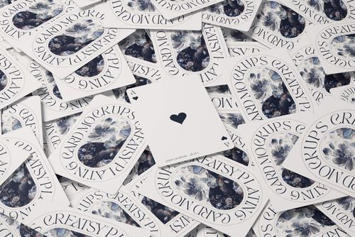 PSD mockup showing a tabletop covered with playing cards, highlighting floral patterns and an ace of spades card.
