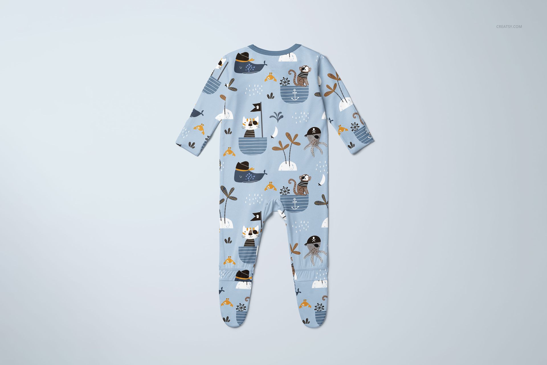 PSD mockup of a baby footie onesie with long sleeves, decorated with whimsical animal and boat motifs on a pale blue fabric.