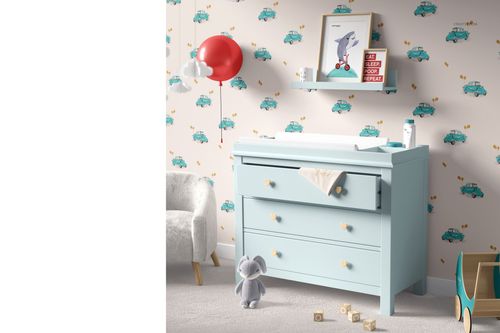 Front view of a nursery with a pastel blue changing pad mockup, decorative wall shelf, and toy elephant on the floor.