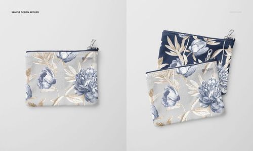 Flat canvas pouch with floral pattern in blue and beige tones, shown from the front and partially overlapping on a light surface.