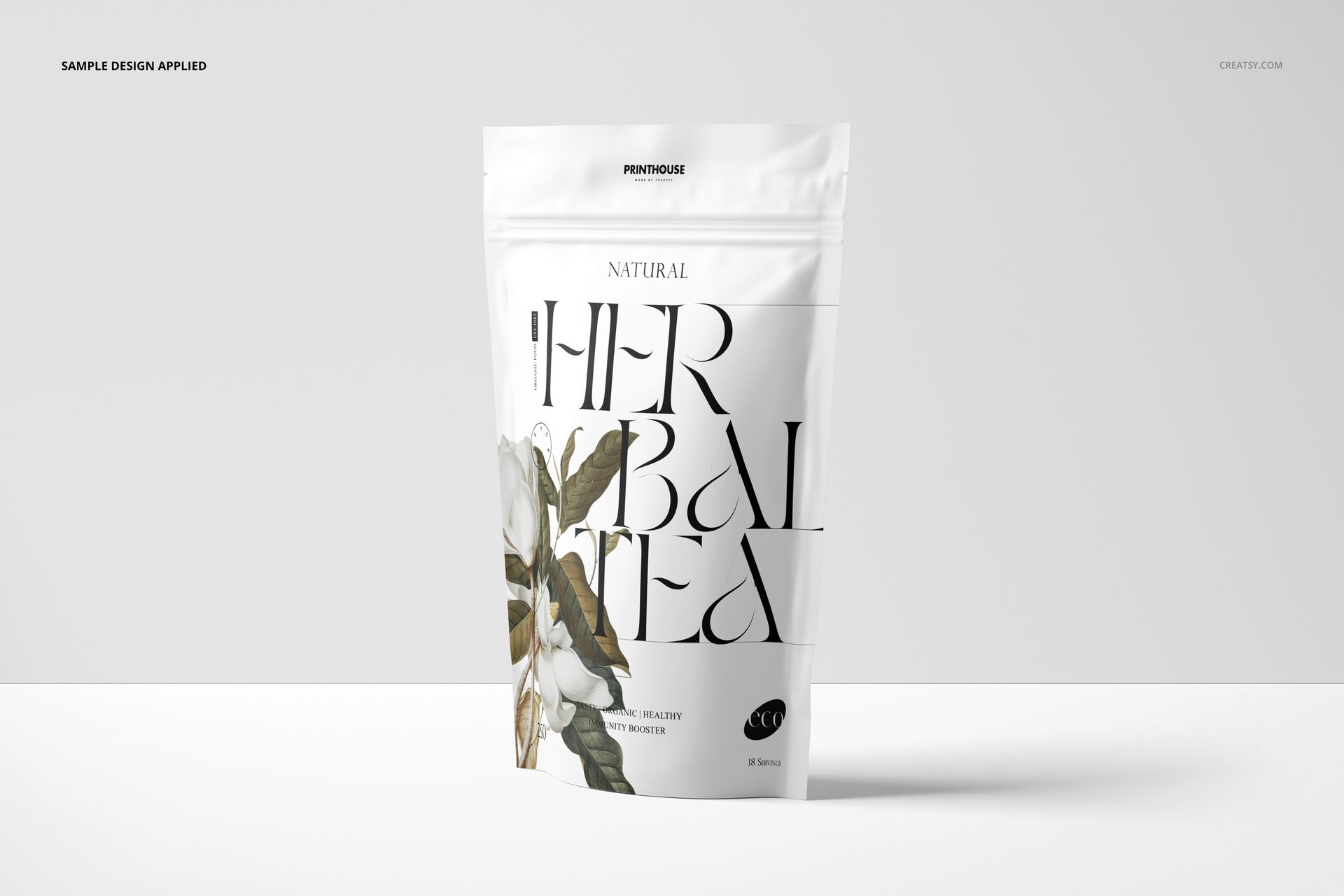 Stand up zip lock packaging mockup featuring floral illustrations and large black lettering, shown upright on white.