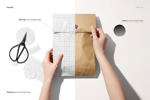 PSD mockup showing a person attaching a sticker to a paper bag, with scissors and patterned paper nearby.
