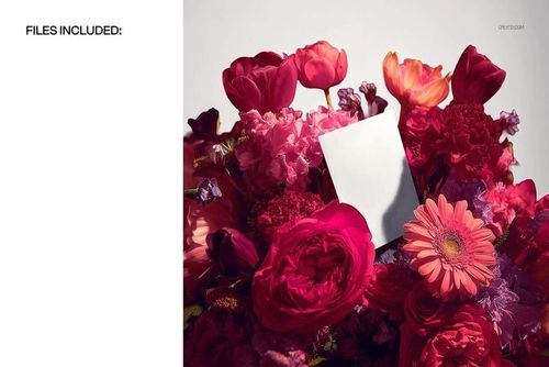 Greeting card mockup displayed in a vibrant flower bouquet with pink, red, and orange blossoms, front view.