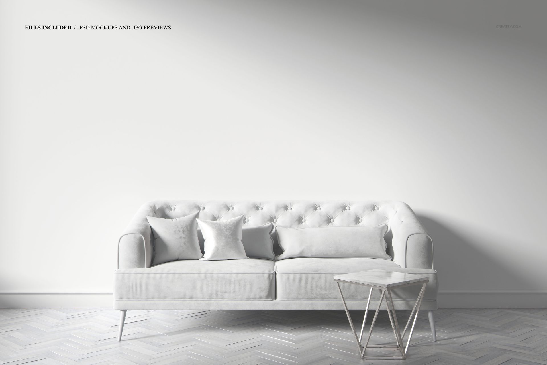 PSD mockup showing a stylish art deco sofa with soft upholstery, two cushions, and a sleek side table against a blank wall.