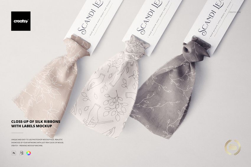 Three silk ribbons with attached labels, shown in neutral tones and delicate patterns, arranged side by side in a mockup.