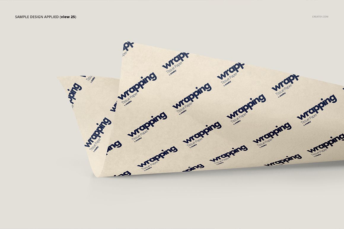 Front view of wrapping tissue paper mockup featuring a diagonal layout and a blue text pattern on beige paper.