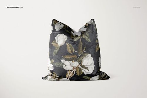Decorative pillow mockup featuring a soft velvet texture, large white flowers, and green leaves on a black background.