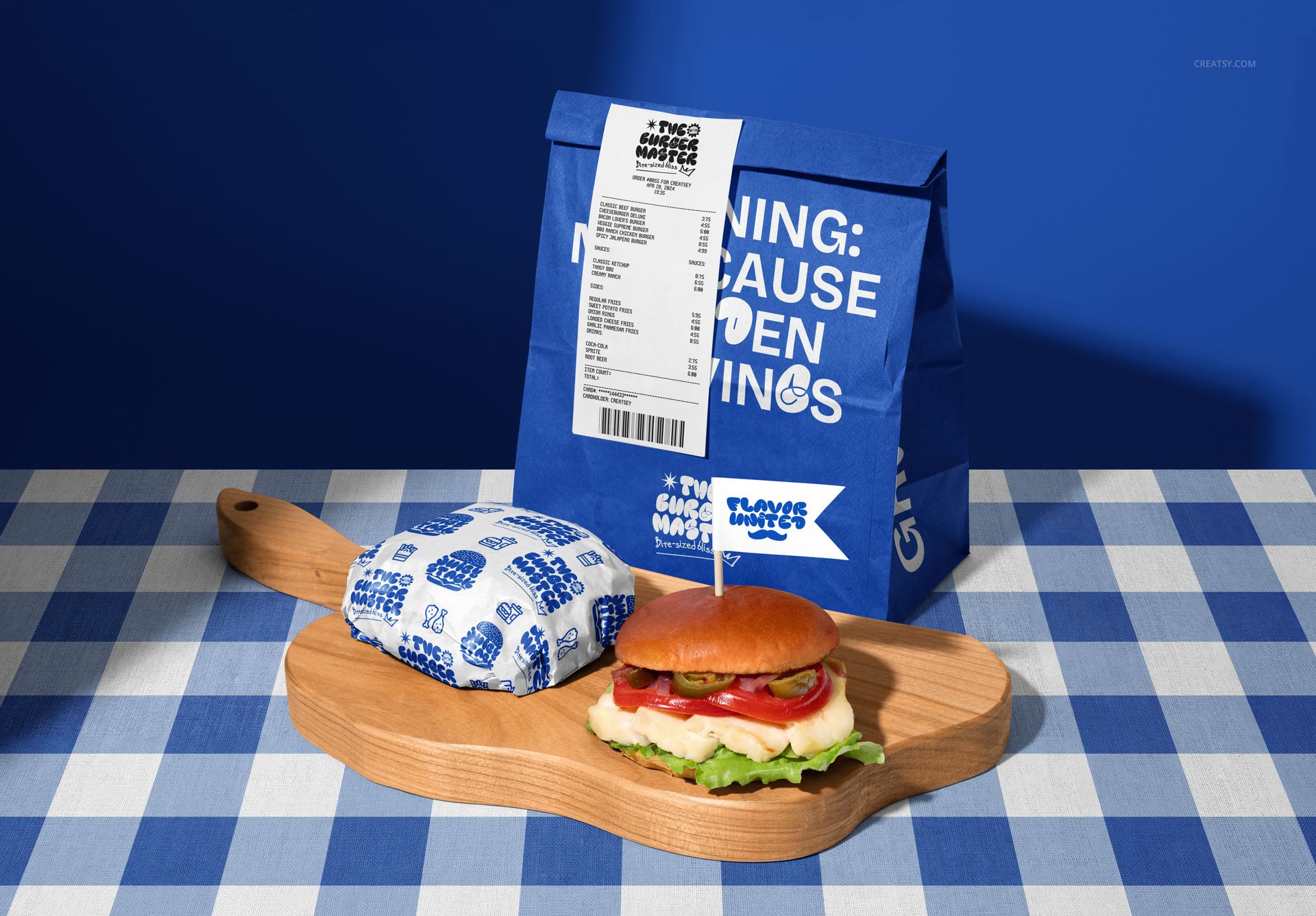 Mockup of vegan burger bar packaging, featuring a blue paper bag, wrapped burger, and wooden serving board.