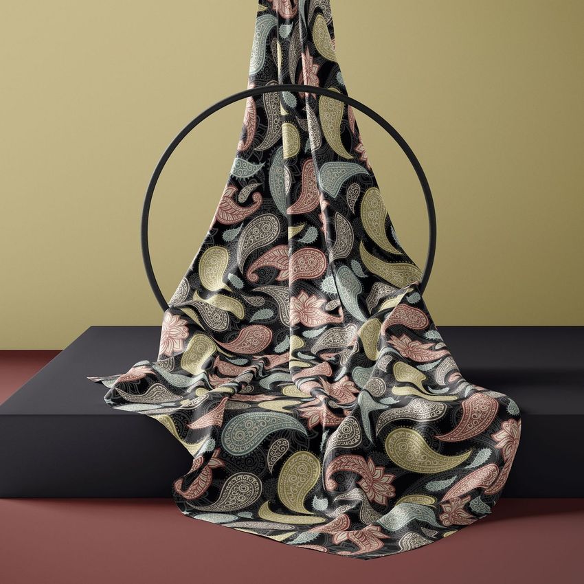Silk scarf mockup featuring an abstract paisley pattern in muted pink, yellow, cream, and black draped over a circular stand.