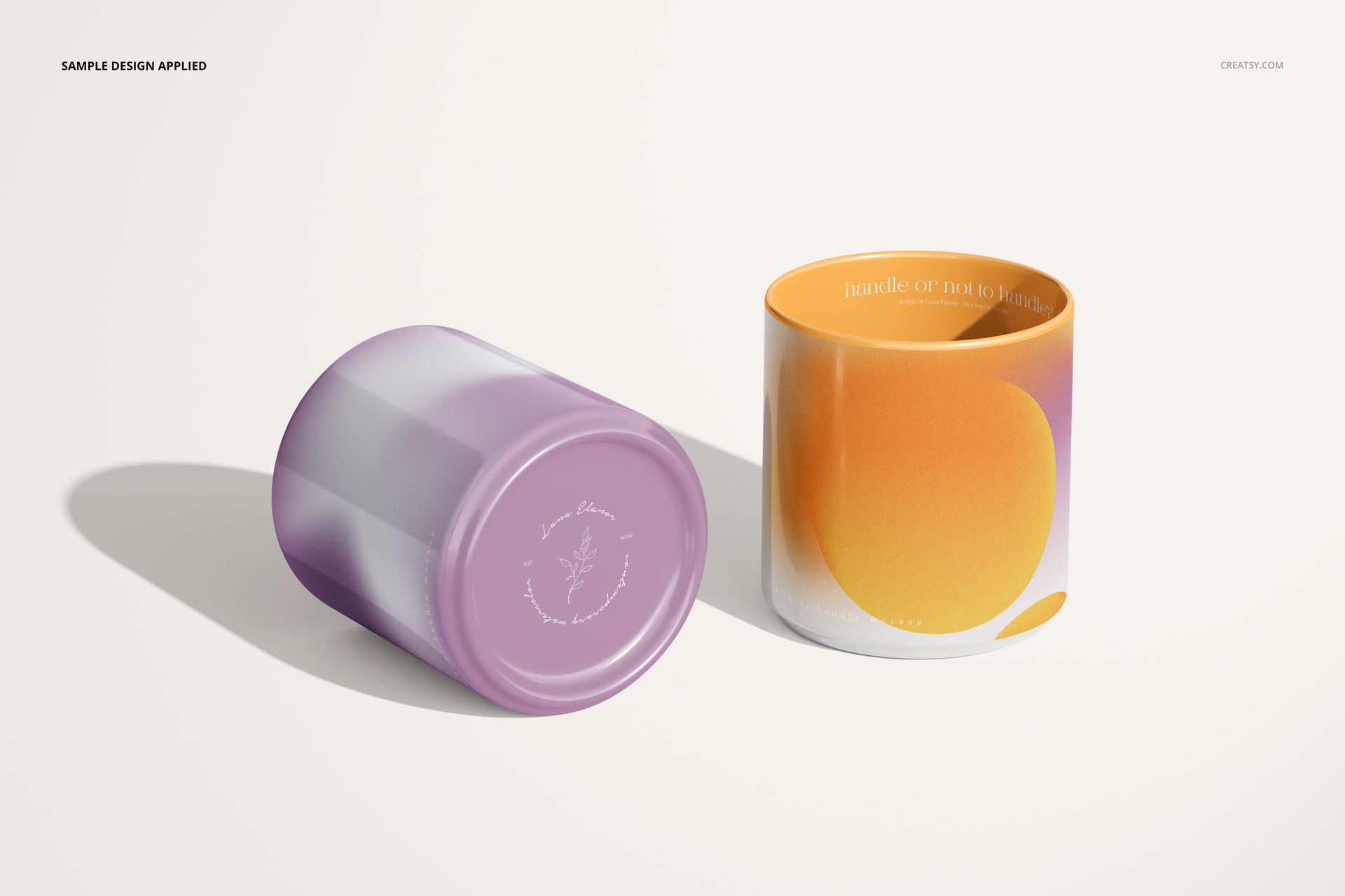 Handleless mug PSD mockup set featuring one mug standing with a circular orange pattern and one mug on its side with purple stripes.