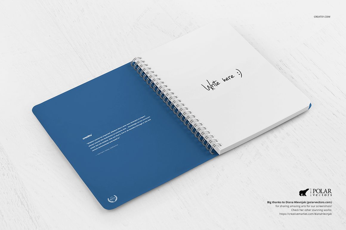 Open spiral notebook with blue cover and white pages, displayed on a light wooden surface in a stationery mockup.