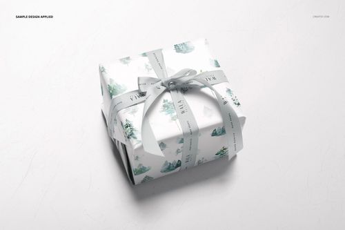 Gift wrapping paper mockup featuring a rectangular box with soft blue and green designs, viewed from above.