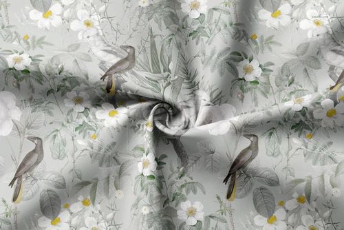 PSD mockup of curtain fabric featuring gray and white flowers and birds, displayed with natural folds and creases.