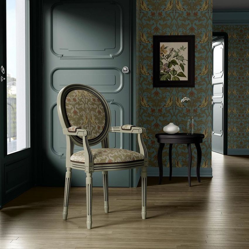 Living room armchair mockup with medallion back, featuring a botanical pattern, set against ornate wallpaper and wood flooring.