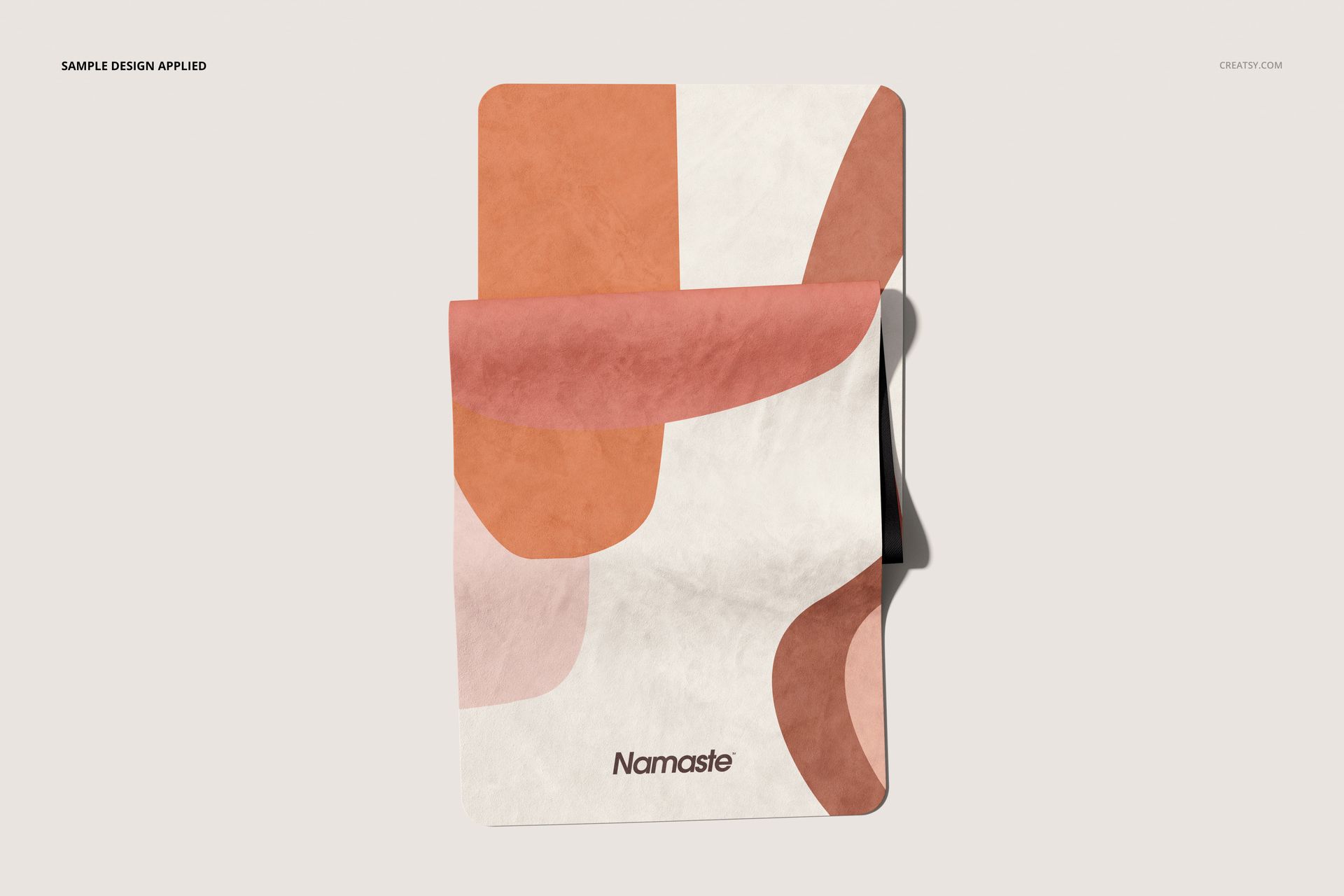 Yoga mat mockup featuring soft microfiber suede material and overlapping shapes in muted pink and cream colors.