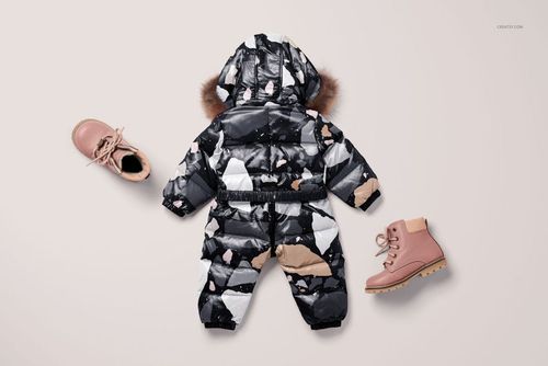 Kids snow suit mockup featuring a fur-trimmed hood and geometric print, shown with pink boots on a neutral background.