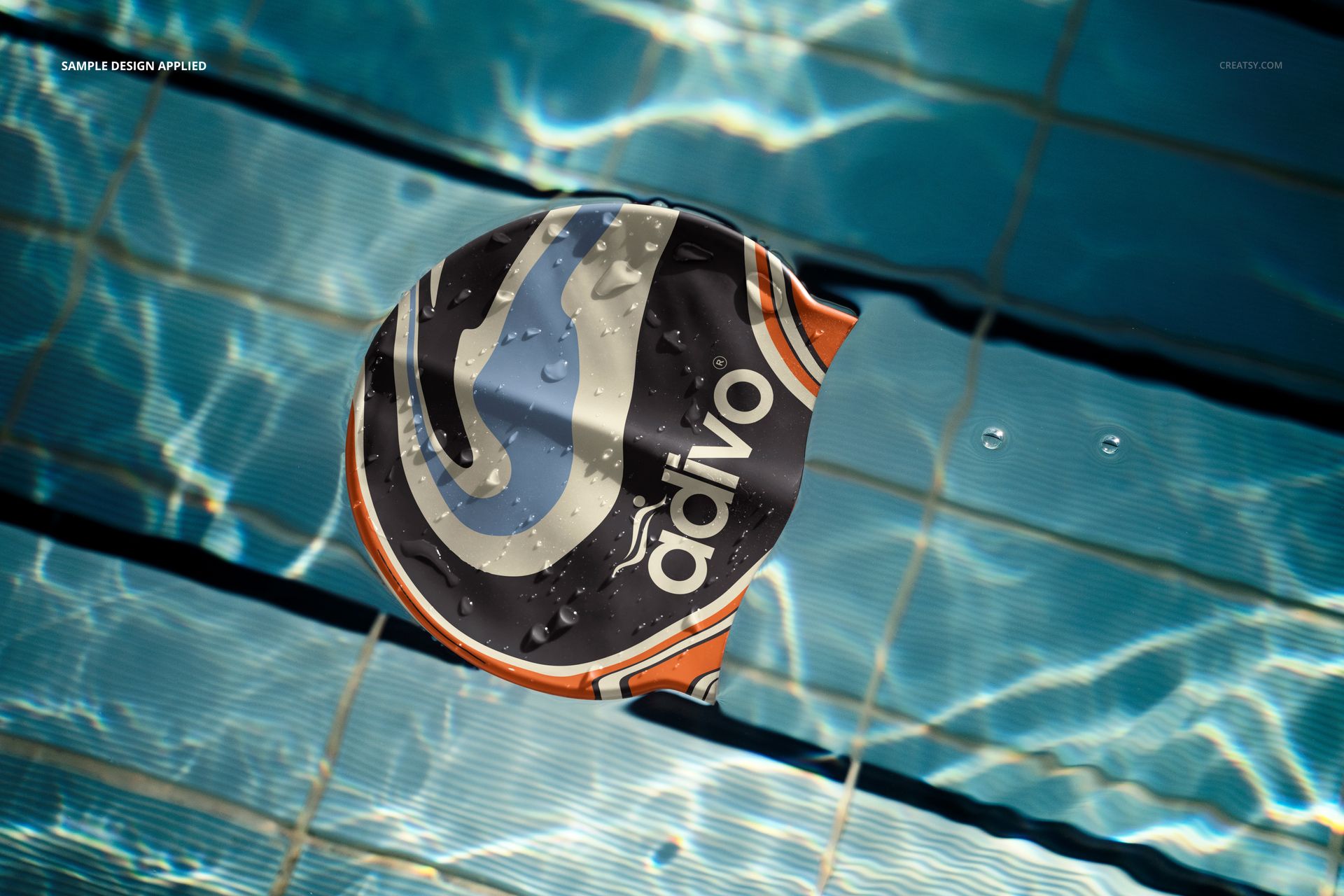 Top view of a swim cap mockup featuring a colorful pattern, placed in a clear swimming pool with rippling water.