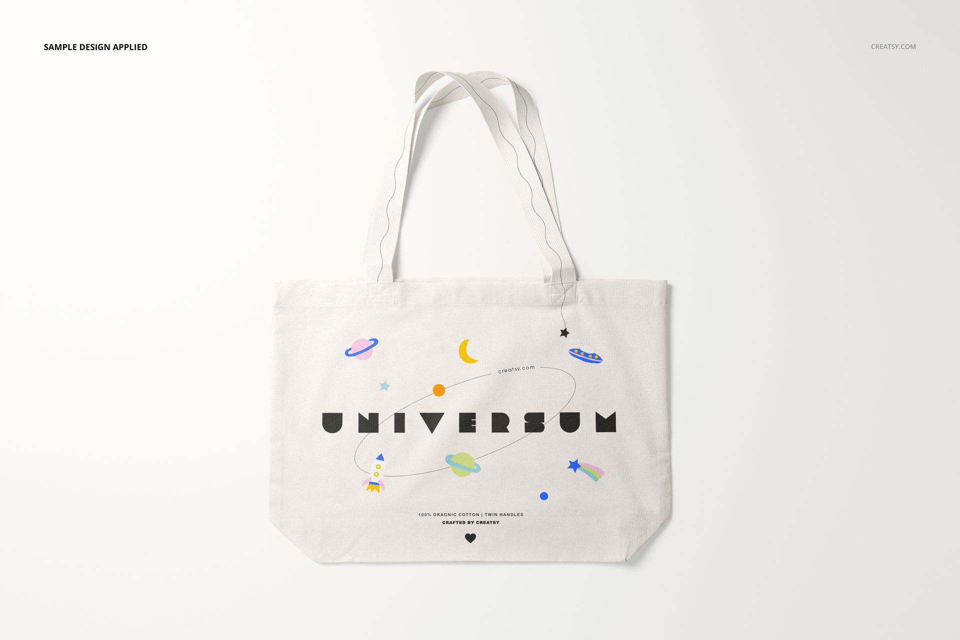 Front view of a weekender tote bag mockup with white fabric and playful space-themed illustrations on a plain background.