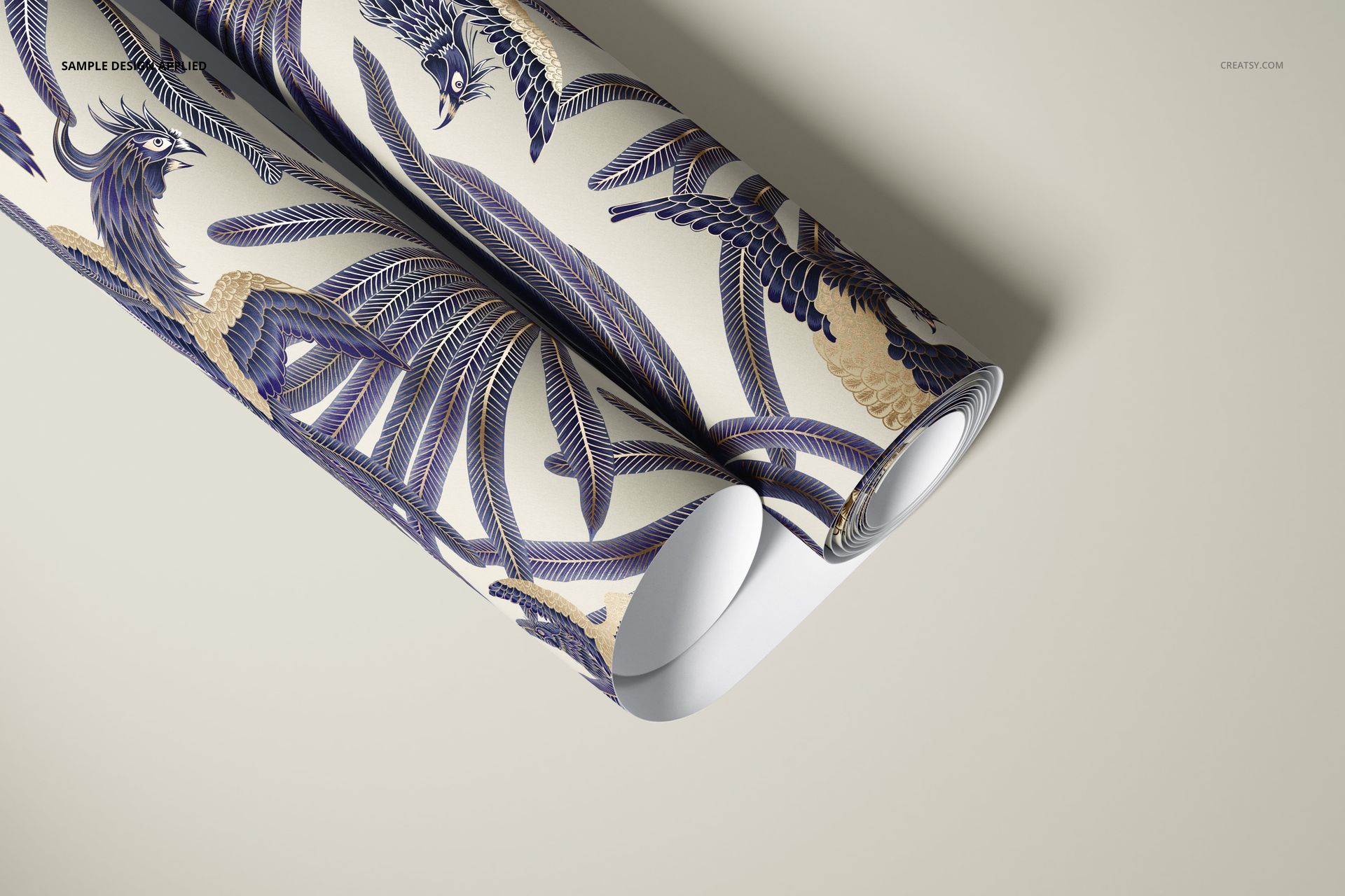 PSD mockup of paper wallpaper with intricate blue and gold bird motifs, presented as rolled sheets on a beige background.