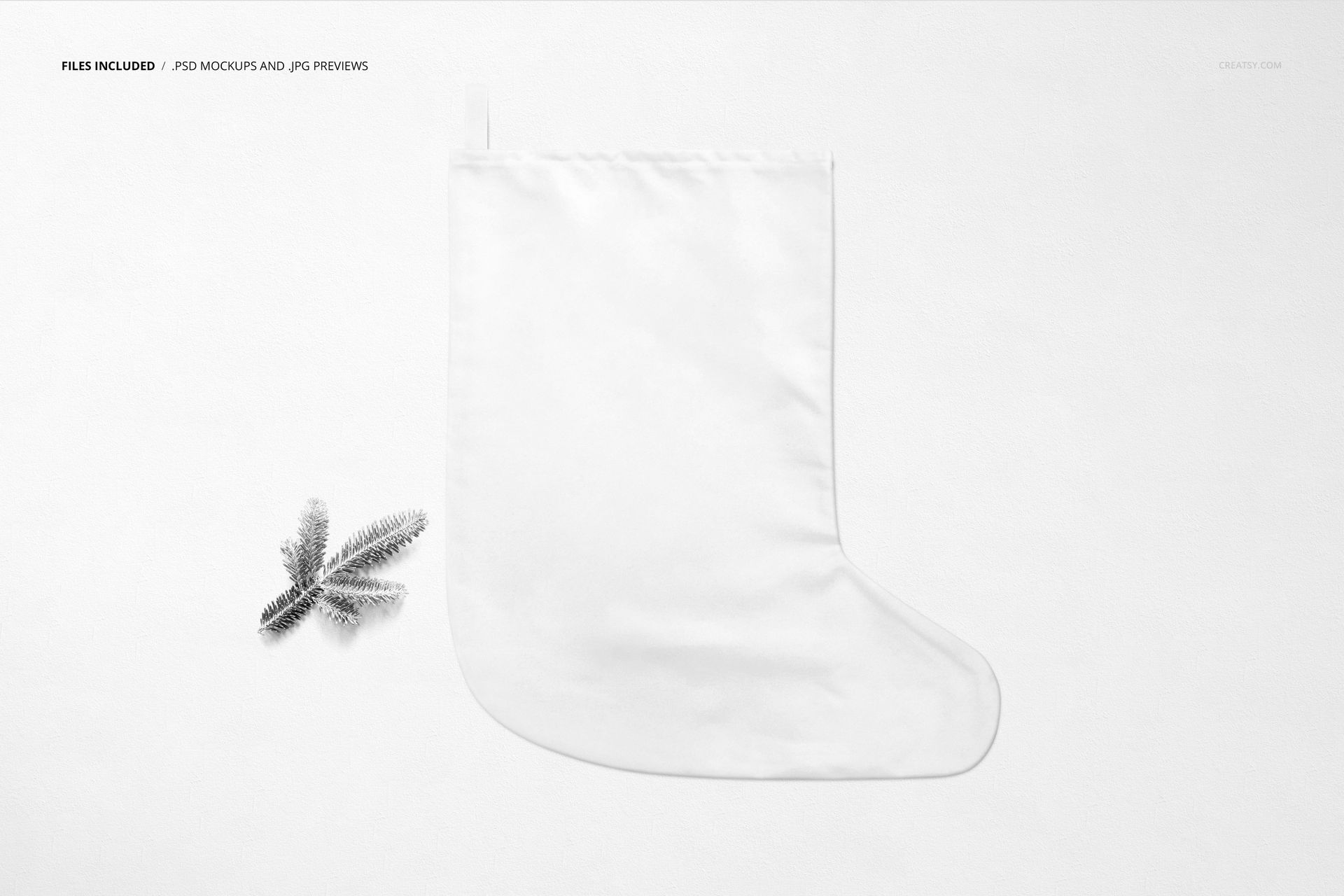 White Christmas stocking mockup shown in top view on a light background with a small pine branch beside it.