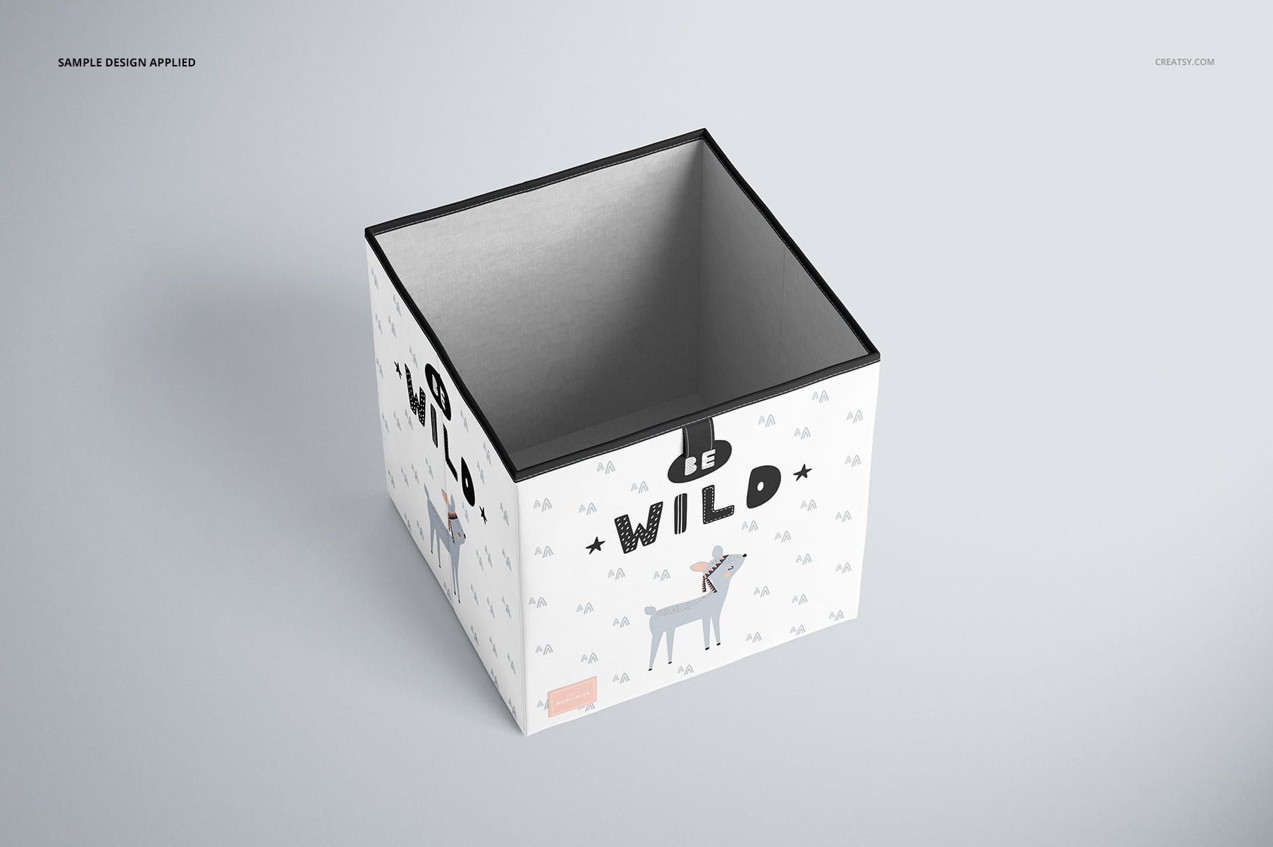 Mockup of a square folding storage box with cartoon dog and decorative text, shown from a slightly elevated perspective.