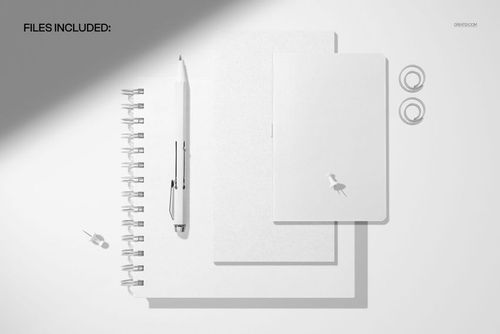 Stationery mockup featuring a spiral journal and softcover notebooks with minimal white design, viewed from above.