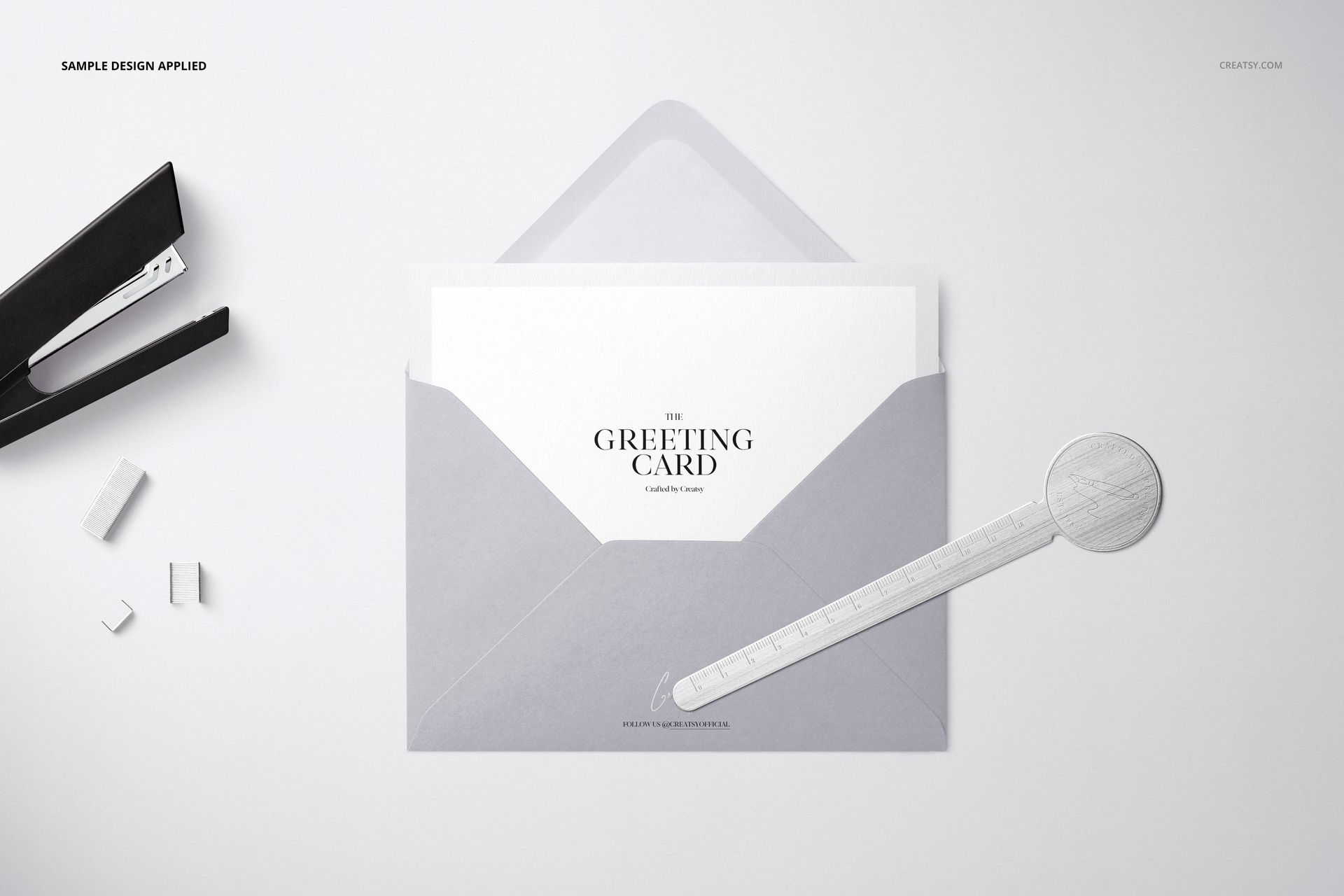 Top view of a light gray C6 envelope mockup with a card partially inserted, placed on a clean white background.