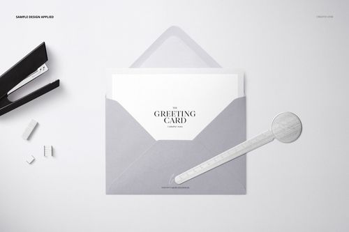 Top view of a light gray C6 envelope mockup with a card partially inserted, placed on a clean white background.